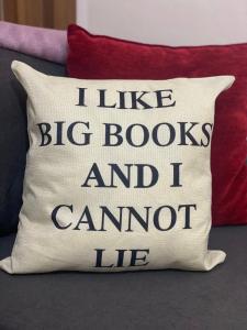 a pillow that says i like big books and i cannot lie at Chlo apartment 4 Tirane in Tirana