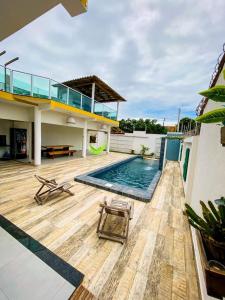 a house with a swimming pool and a deck at Villa Prado in Prado