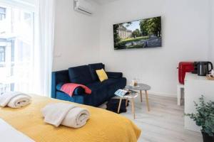 a living room with a bed and a couch at Lux Nest I City Apartment URBAN STAY in Zagreb