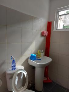 a bathroom with a toilet and a sink at The Greens Home & Garden -ENTIRE 2nd FLOOR 3 Bedroom Unit in Baguio