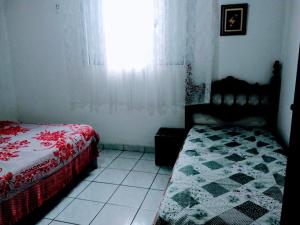 Posteľ alebo postele v izbe v ubytovaní Casa à 30 metros da praia