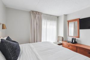 a hotel room with a bed and a window at Cape Suites Room 7 - Free Parking! Hotel Room in Rehoboth Beach