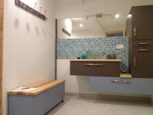 a bathroom with a sink and a counter top at Maison lumineuse avec sauna, terrasse sud, proche Gérardmer, animaux acceptés - FR-1-589-369 in Gérardmer +17 photos