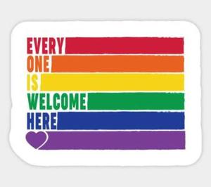 a sign with a rainbow curb with the words every one is welcome here at Beautiful Apartment Overlooking a Garden in London