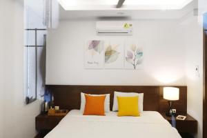 Katil atau katil-katil dalam bilik di Luxe Paradise residence 22 Nam Ngu street