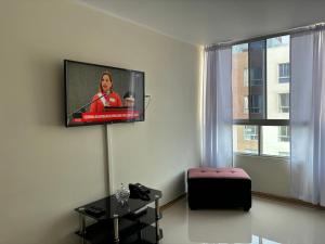 A television and/or entertainment centre at Imagine Apartment