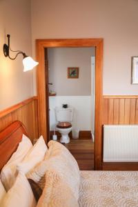 Postel nebo postele na pokoji v ubytování Te Anau Lodge