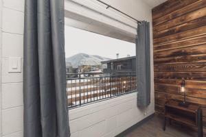 a room with a window with a view of a balcony at Bel Aire Motel in Missoula