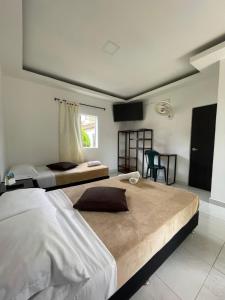 Postel nebo postele na pokoji v ubytování Hotel Campestre Nogal de Cafetal + 37 fotografií