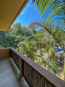 a balcony with a view of the jungle at Quinta Viajero in Zipolite