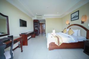 Rúm í herbergi á Classy Hotel & Spa