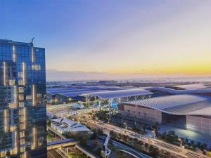 an aerial view of a city with a building at Royal Executive Apartment, Shenzhen World Exhibition & Convention Center, Nearby Shenzhen World North Metro St ation in Bao'an