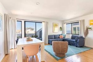 a living room with a couch and a table at Ocean View 1 BR Dream Escape in Manhattan Beach in Manhattan Beach