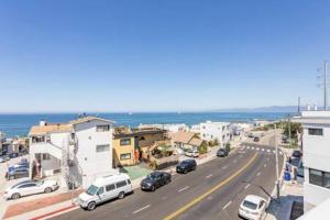 a street with cars parked on the side of a road at Ocean View Suite Manhattan Beach Patio in Manhattan Beach