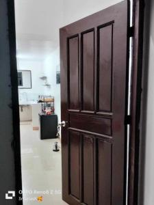 een open deur in een kamer met een keuken bij 3K’s Transient house in Bagac in Malawin