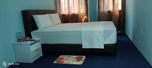 Postel nebo postele na pokoji v ubytování Hotel Blue Orchid