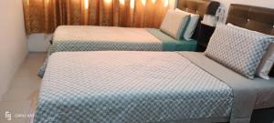 Postel nebo postele na pokoji v ubytování Hotel Blue Orchid