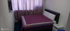 Postel nebo postele na pokoji v ubytování Hotel Blue Orchid