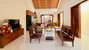 a kitchen and dining room with a table and chairs at 50b Homestay in Tây Ninh