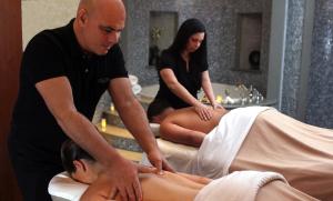 a man and a woman getting a massage at The Inn and Spa at East Wind in Wading River