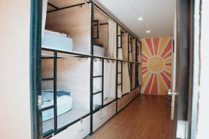 a hallway with bunk beds in a room at Tequila Sunrise Hostel in Guatemala