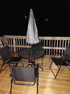 a black table with chairs and a napkin on it at ~Como's Finest ~A Home Away From Home ~Sleeps 10 ~ in Columbia