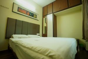 Кровать или кровати в номере Sri Govindham Home Stay
