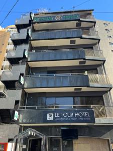 a building with a sign for a hotel at Le Tour Hotel Akihabara Kanda 楽途ホテル神田秋葉原 in Tokyo