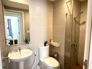 a bathroom with a toilet and a sink and a shower at 1,2 BEDROOM in MASTERI THAO DIEN in Ho Chi Minh City
