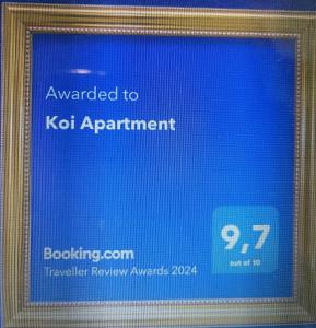 a picture of a sign that says awarded to kdot appointment at Koi Apartment in Da Nang