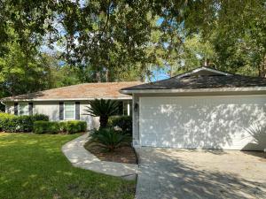 a white garage in front of a house at Welcome to Cozy and Quiet Residence in Valdosta