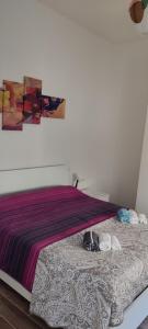 Postel nebo postele na pokoji v ubytování Lago Maggiore Lake Me Home apartment