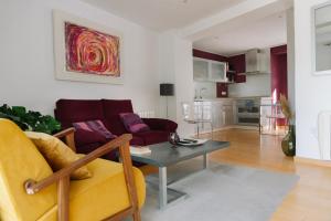 a living room with a couch and a table at Capricho de Zuheros in Zuheros
