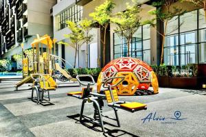a playground in a building with slides and swings at NEW! [Romantic Honeymoon] Imperio Studio Bathtub/4 pax/Game/MelakaRaya in Melaka
