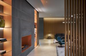 a lobby with a waiting room with a fireplace at Four Points by Sheraton Venice Mestre in Mestre