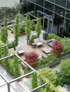 an overhead view of a building with chairs and plants at Four Points by Sheraton Venice Mestre in Mestre