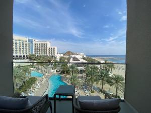 a view of the beach from a resort balcony at Dream Inn - Address Beach Residence - Free Beach Access in Fujairah