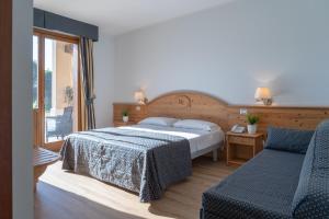 Posteľ alebo postele v izbe v ubytovaní Hotel Canova Sport & Relax