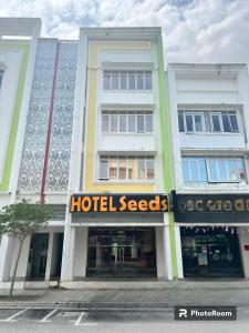 a building with a hotel secrets sign in front of it at Seeds Hotel Putrajaya in Putrajaya