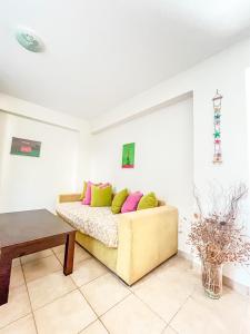 a living room with a couch and a table at Mistral Houses in Meganisi