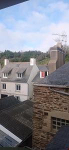 a view of roofs of houses in a city at Le Querrien in Cancale