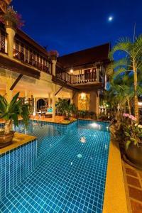 a swimming pool in the middle of a house at Entire 5 beds Pool Villa on hill side. in Amphoe Koksamui