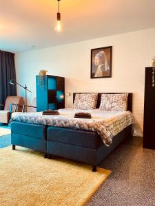 Ένα ή περισσότερα κρεβάτια σε δωμάτιο στο Moderne Studio's Twente
