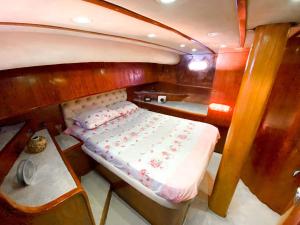 a small bed in the back of a boat at Bodrum Private Boat Tours -Daily -Yacht Tours Bodrum in Bodrum City
