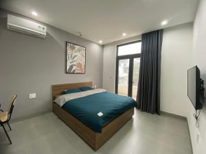 Llit o llits en una habitació de Chuỗi căn hộ Space Apartment & Homestay tại Vinhomes Marina Hải Phòng