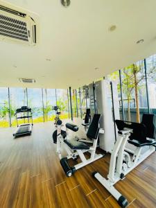 a gym with treadmills and elliptical machines at Dorsett Suites City Center KL in Kuala Lumpur