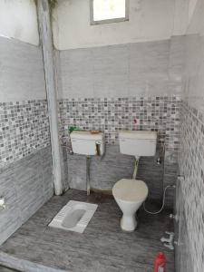 Um banheiro em Hotel Omni Palace By BookingCare