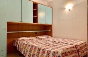 Postel nebo postele na pokoji v ubytování Agata Apartment - 250 m dal Lago di Garda Sirmione