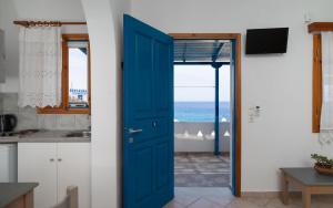 A kitchen or kitchenette at Iliovasilema VILLAGE