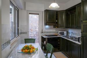 A kitchen or kitchenette at SARA GUEST HOUSE TAORMINA